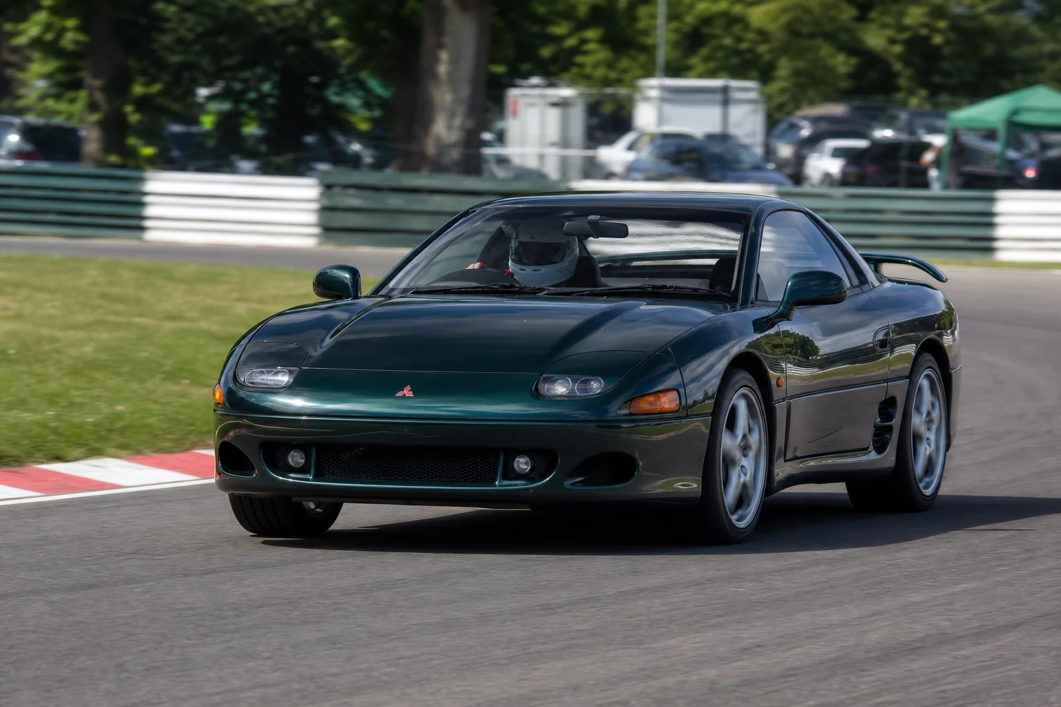 Mitsubishi GTO/3000GT on track with a helmeted driver