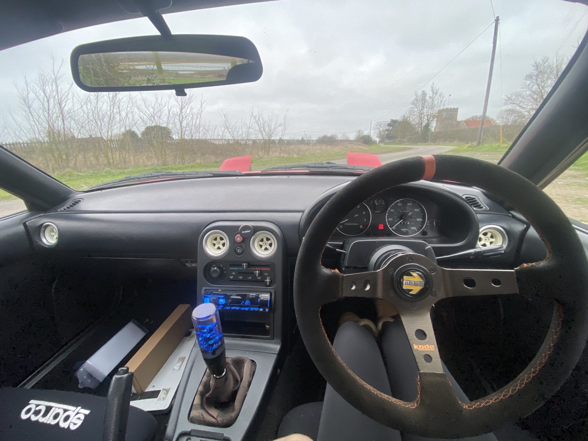 Original worn Mk1 MX-5 interior with a used steering wheel before the rebuild