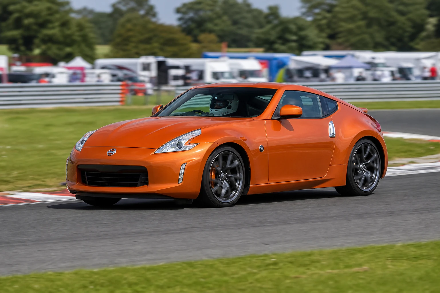 Nissan 370Z on track with a helmeted driver