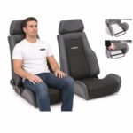 Person seated in Pair of Cobra Le Mans Land Rover Defender Seats (part LMR-V-S-BK-X2) showing real-world seat size and fit – GSM Performance