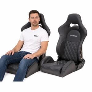 Person seated in Pair of Cobra Misano Anniversary Reclining Sport Seats With Lumbar And Heating showing real-world seat size and fit – GSM Performance