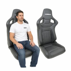 Person seated in Pair of Corbeau Sportline Dakota Leather Reclining Sport Seats (part SS902-Pair) showing real-world seat size and fit – GSM Performance