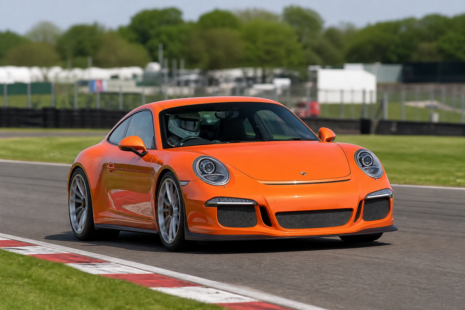 Porsche 911 991 on track with a helmeted driver