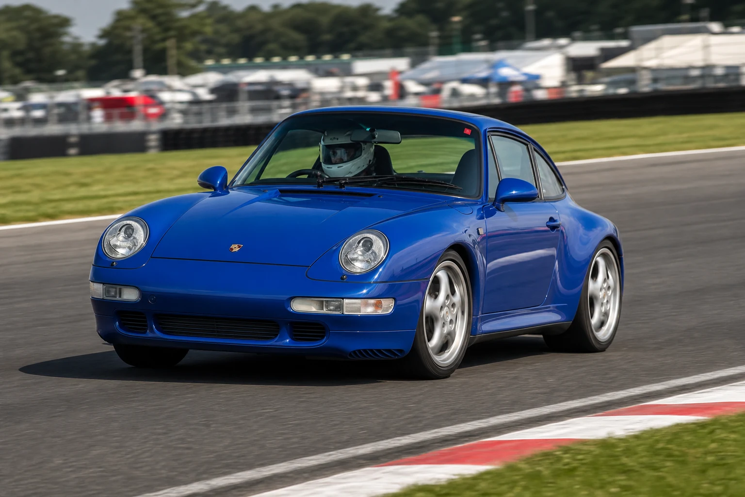 Porsche 911 993 on track with a helmeted driver