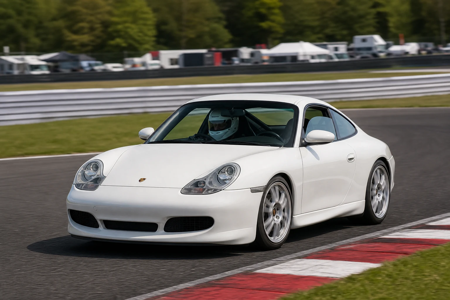 Porsche 911 996 on track with a helmeted driver