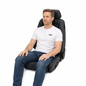 Person seated in Recaro Ergomed E Reclining Sport Seat (part 153.00.1) showing real-world seat size and fit – GSM Performance