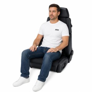 Person seated in Recaro Orthopaed Reclining Sport Seat showing real-world seat size and fit – GSM Performance