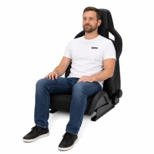 Person seated in Recaro Sportster CS Reclining Sport Seat With Heating And SAB (part 411.10) showing real-world seat size and fit – GSM Performance