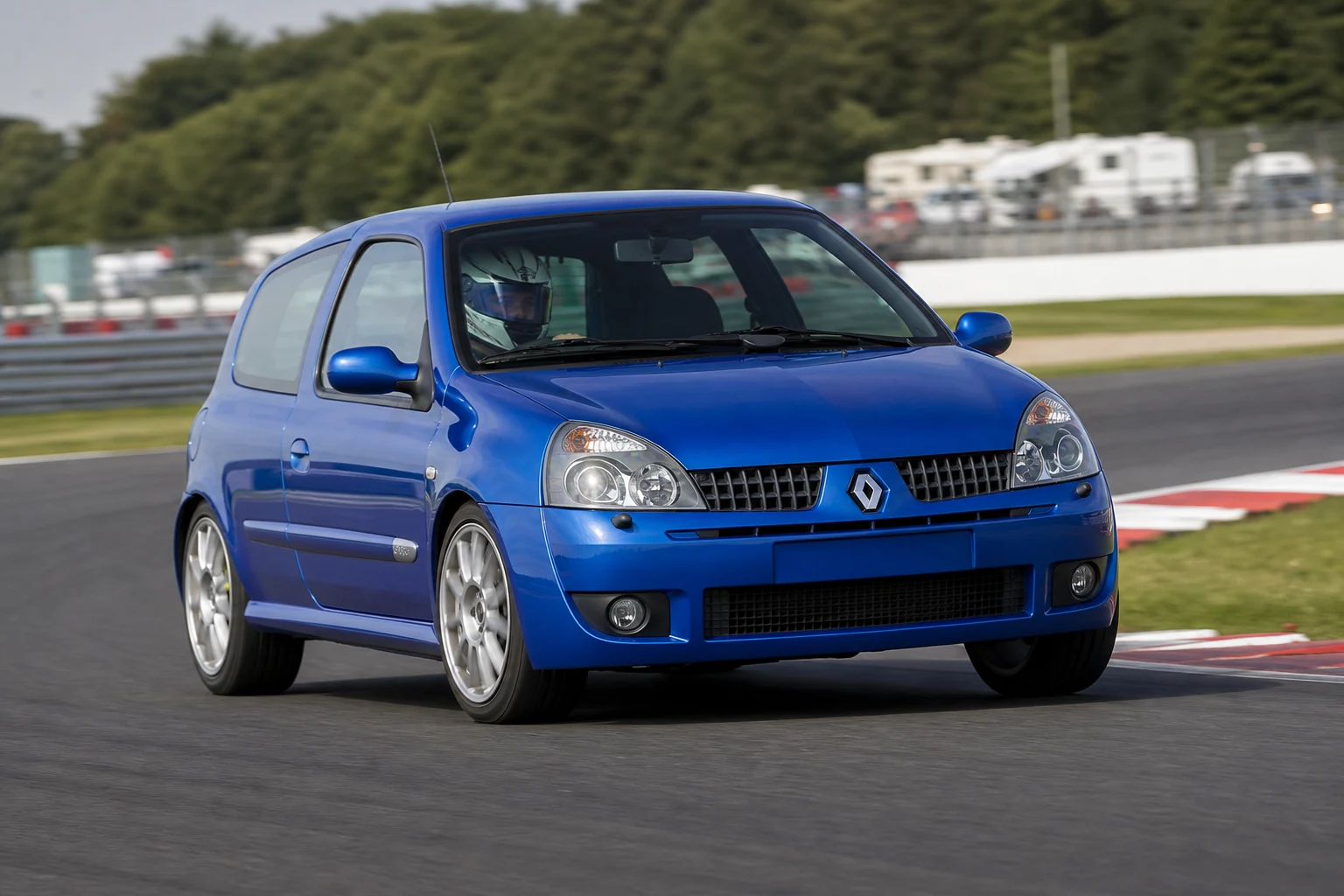 Renault Clio 182 on track with a helmeted driver