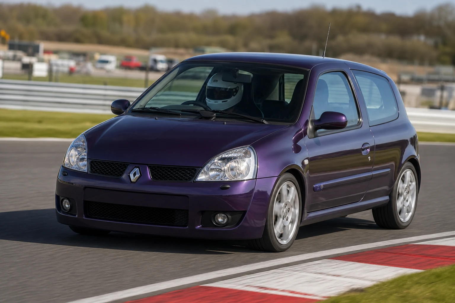 Renault Clio Mk2 on track with a helmeted driver