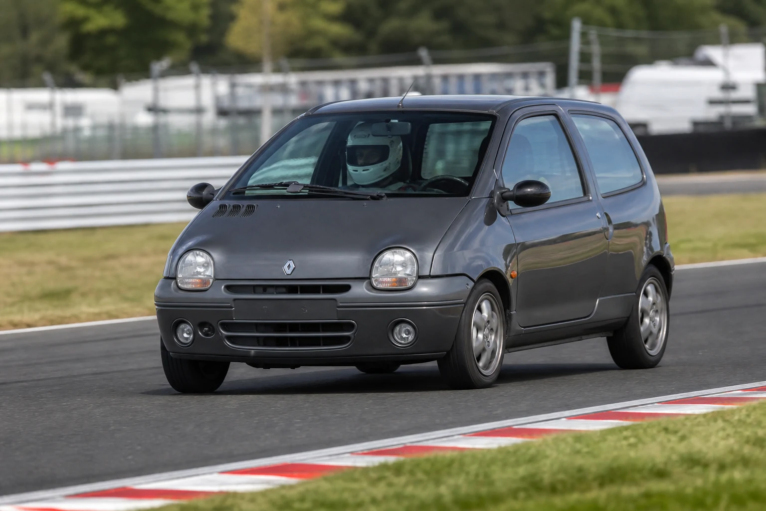 Renault Twingo MK1 on track with a helmeted driver