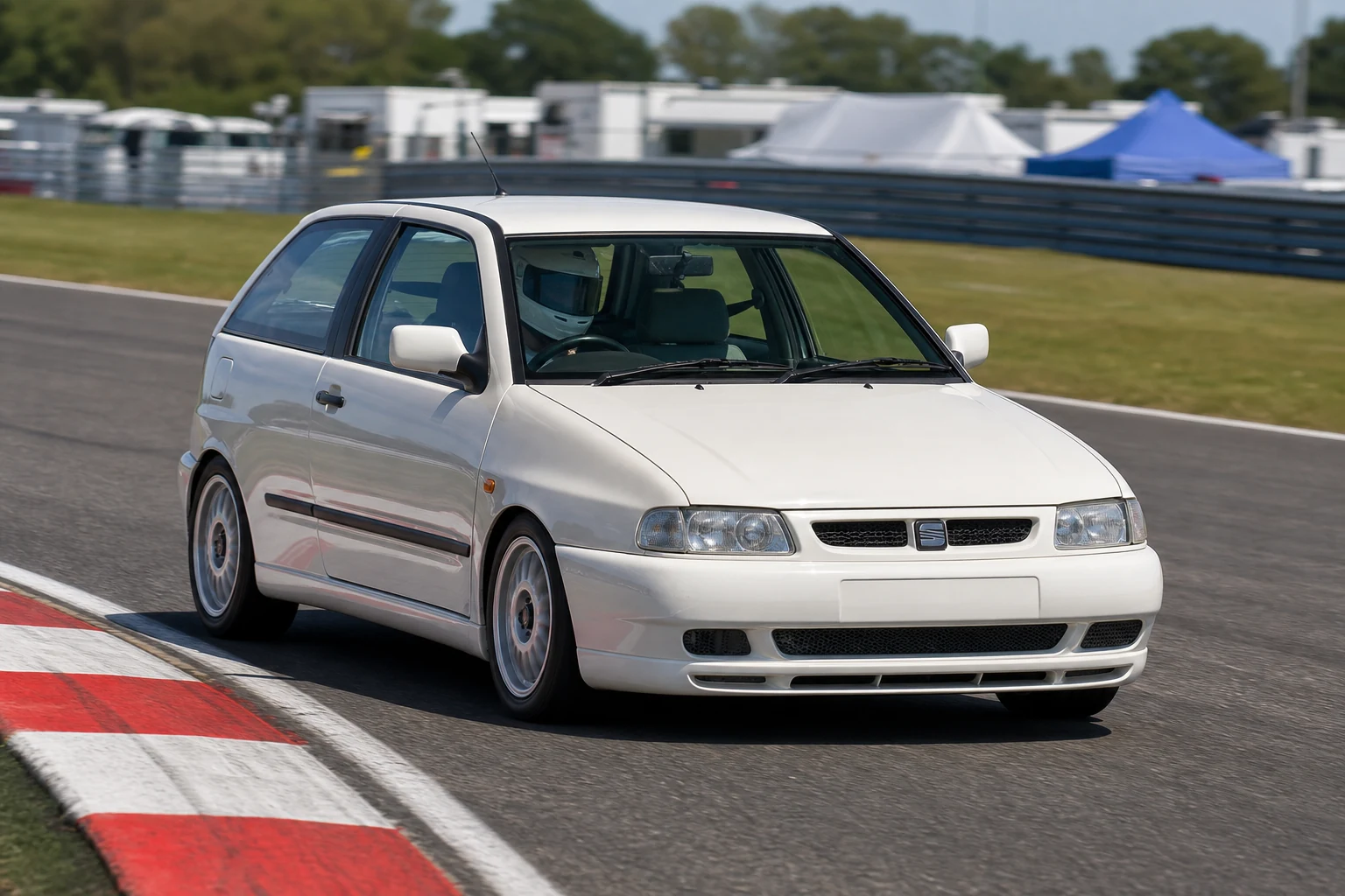 Seat Ibiza MK2 on track with a helmeted driver