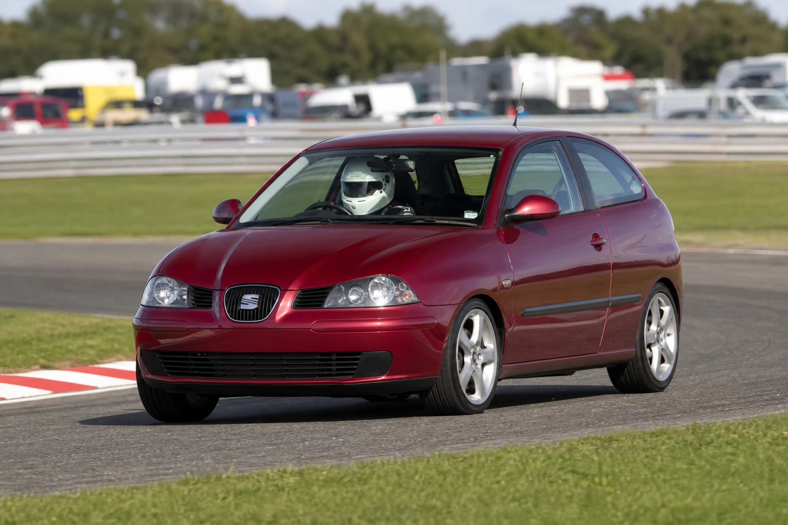 Seat Ibiza MK3 on track with a helmeted driver