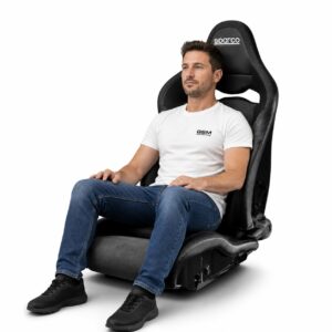 Person seated in Sparco SPR Reclining Sport Seat (part 00906NRNR) showing real-world seat size and fit – GSM Performance
