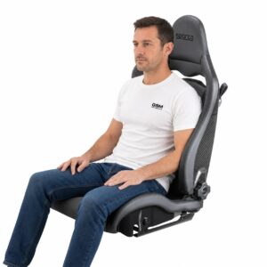 Person seated in Sparco SPX Reclining Sport Seat (part SPA00974ZNR) showing real-world seat size and fit – GSM Performance