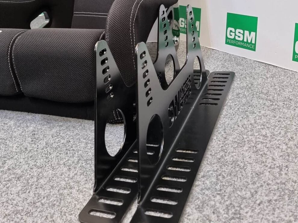 SW Motorsports direct fit seat side mounts stood next to a Mirco bucket seat in the GSM Performance showroom