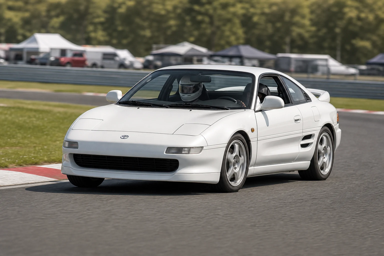 Toyota MR2 on track with a helmeted driver