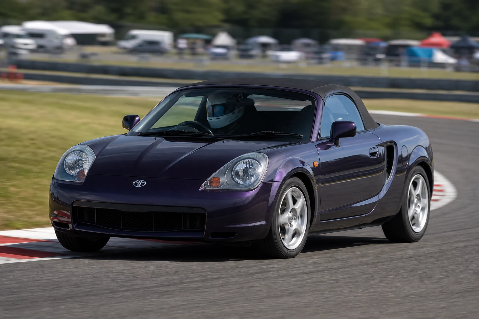 Toyota MR2 W30 on track with a helmeted driver