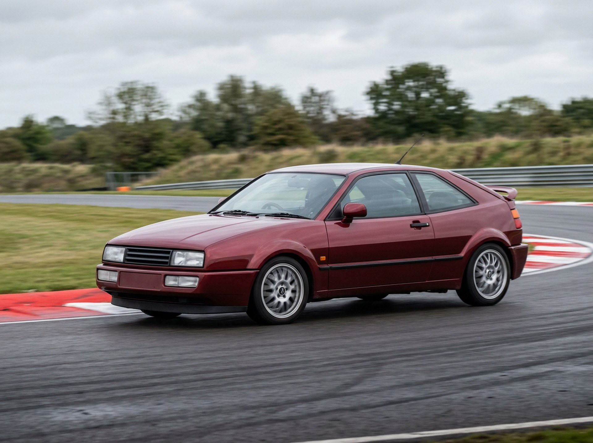 Dark red Volkswagen Corrado cornering on a British race circuit