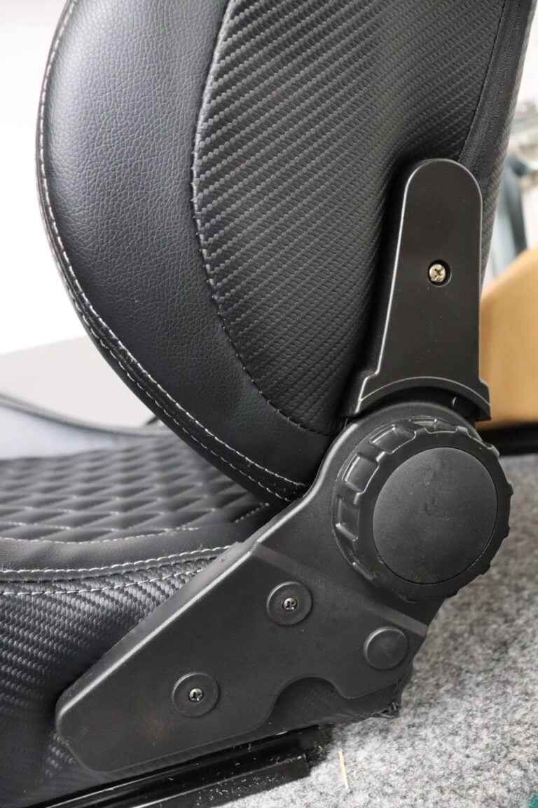 Close up of the round knurled hand wheel on the side of an Auto Style Type AK reclining sports seat