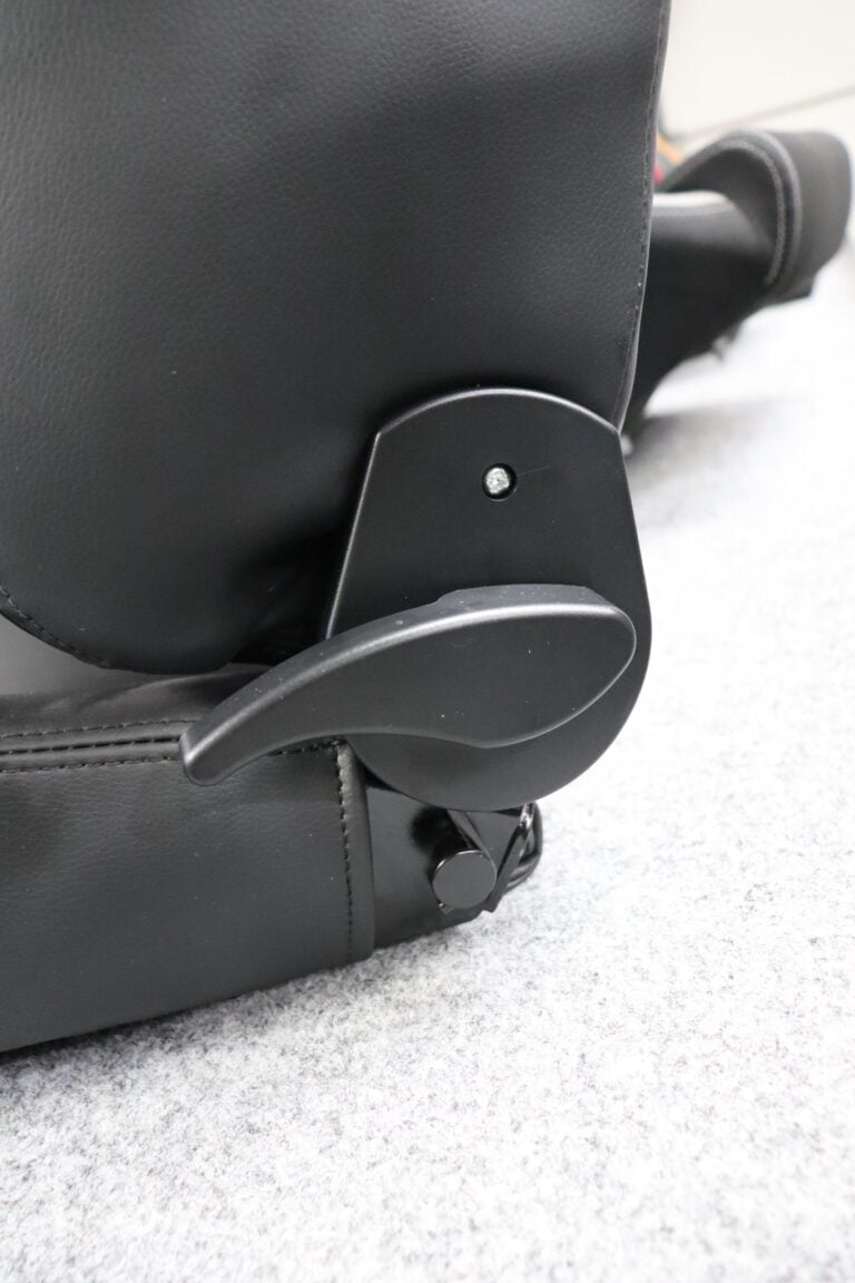 Close up of the curved quick tilt lever on the side of a Sparco R500 Vinyl reclining sports seat