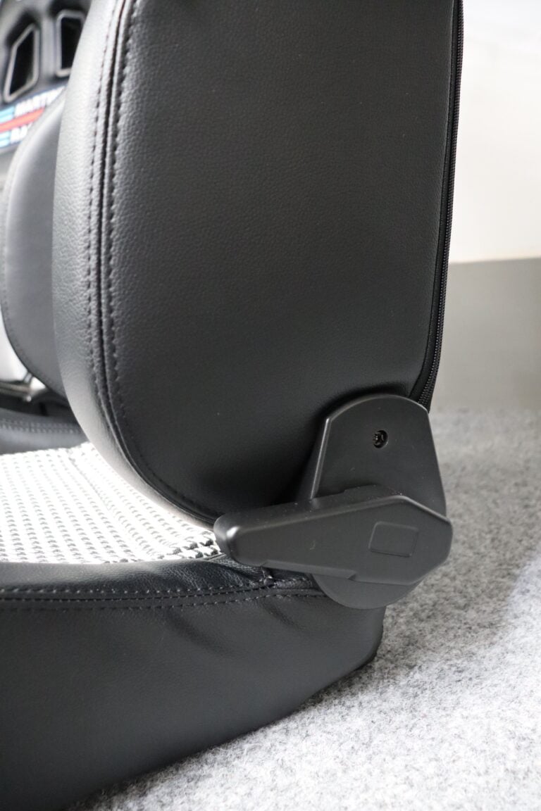 Close up of the quick tilt lever on the side of a Sparco GT Houndstooth Edition reclining sports seat