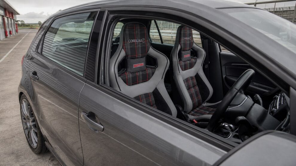 View through the right-hand driver's window of a lightly modified Volkswagen Polo 6C showing Corbeau Sportline RRS Tartan Edition seats