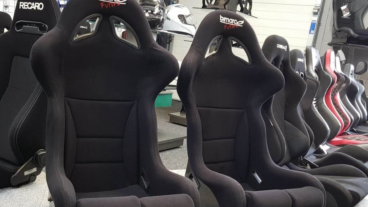 A pair of black Bimarco Futura FIA bucket seats on the showroom seat display