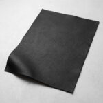 Swatch of black soft grain automotive upholstery leather