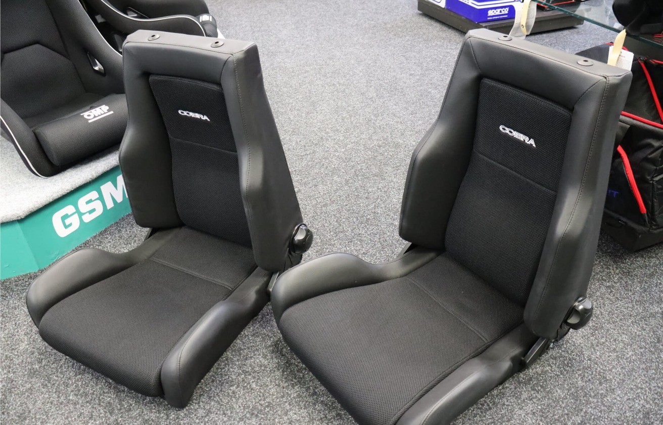 Two Cobra Le Mans Land Rover Defender seats side by side showing the reclining backrests
