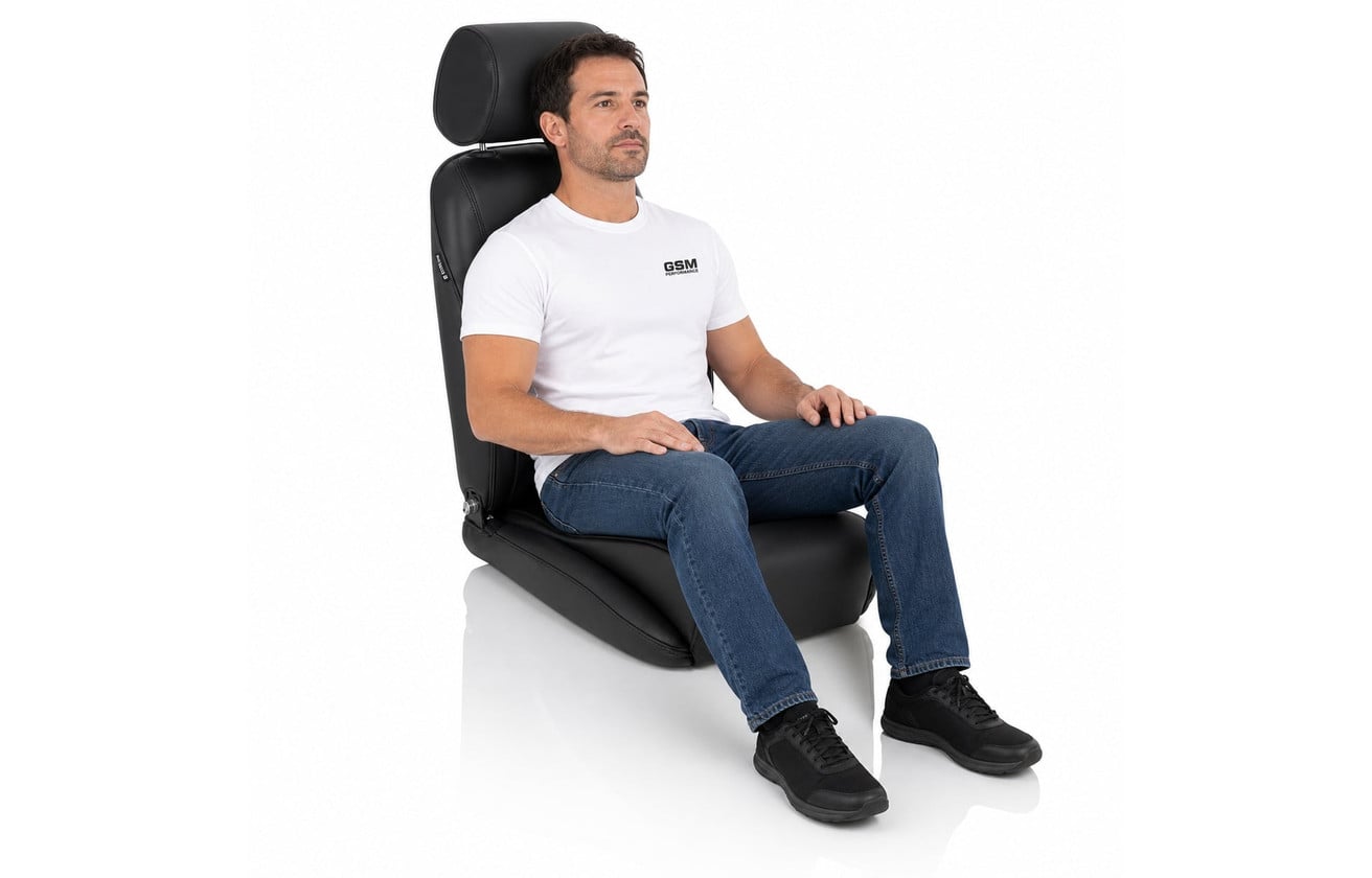 Person seated in a Corbeau Sportsman reclining seat showing the real world width of the cushion and backrest