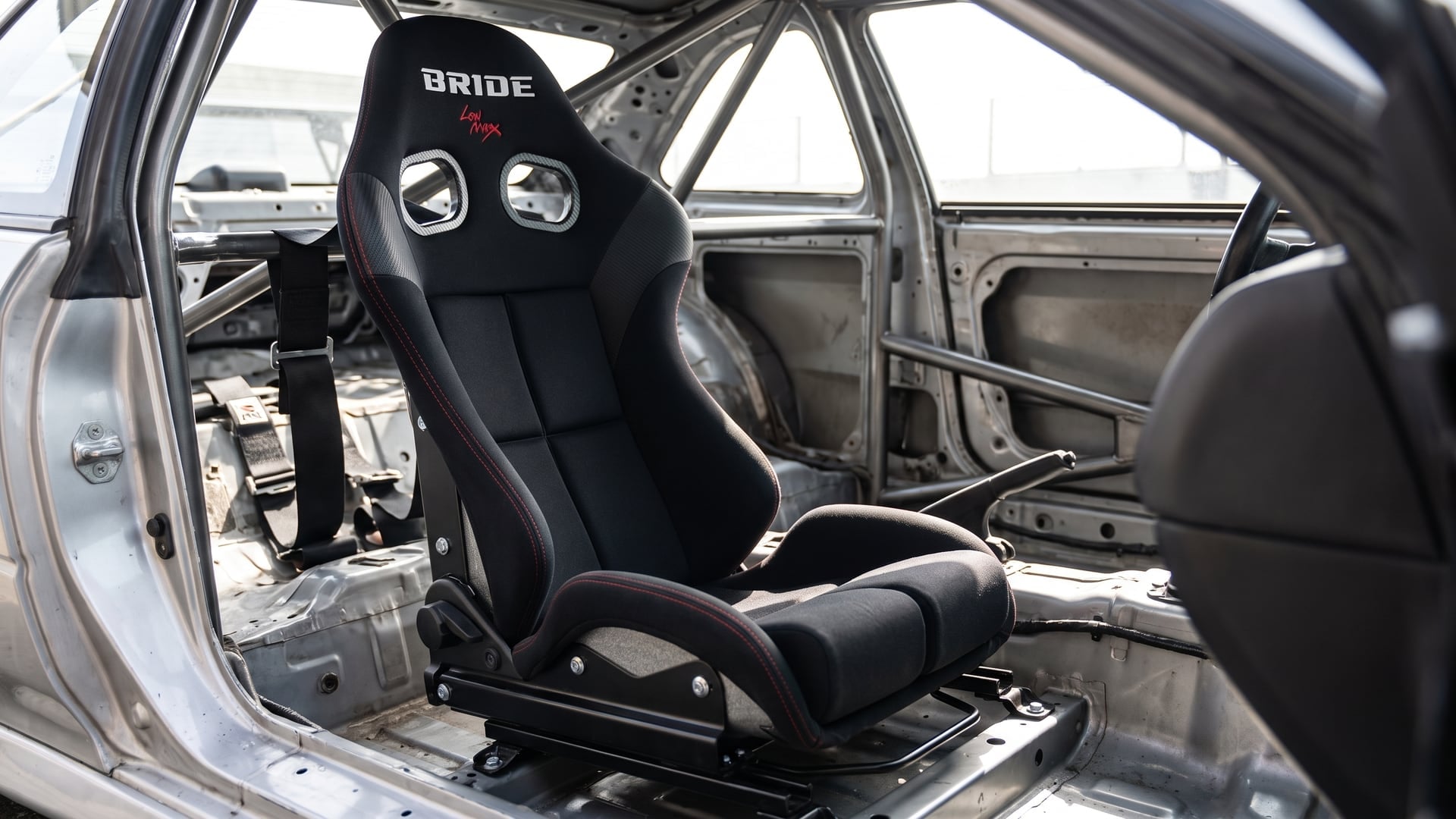 Bride Stradia III reclining sports seat in black with the recline mechanism visible on the side