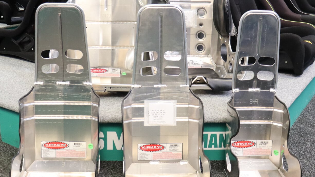 Five Kirkey aluminium racing seats on and in front of the seat display in the GSM Performance showroom