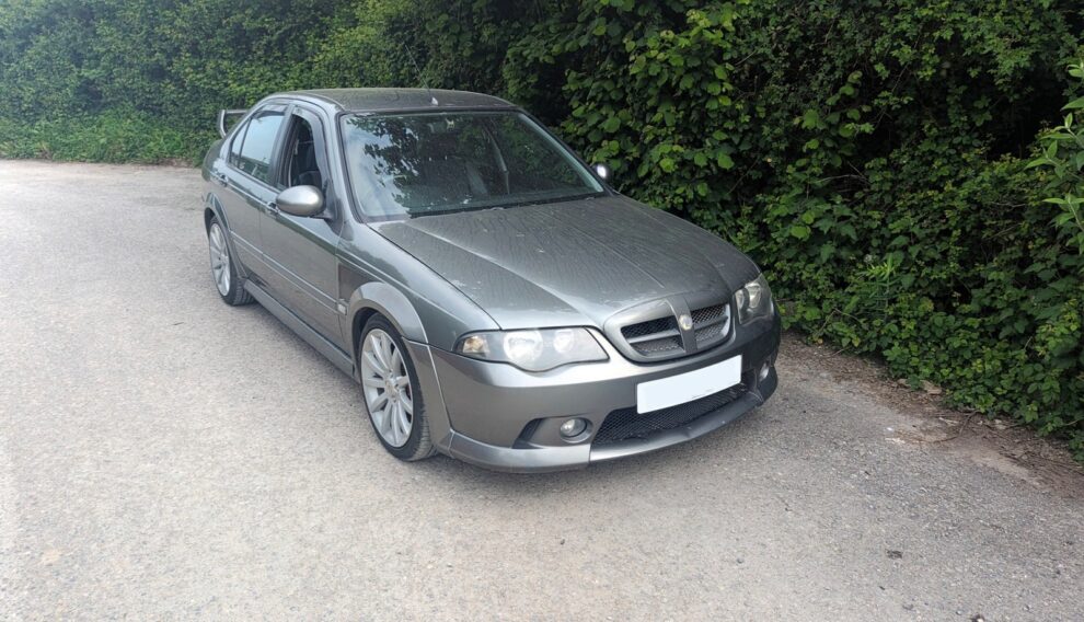 The same MG ZS photographed on collection day in May 2024, standing unwashed on a country lane