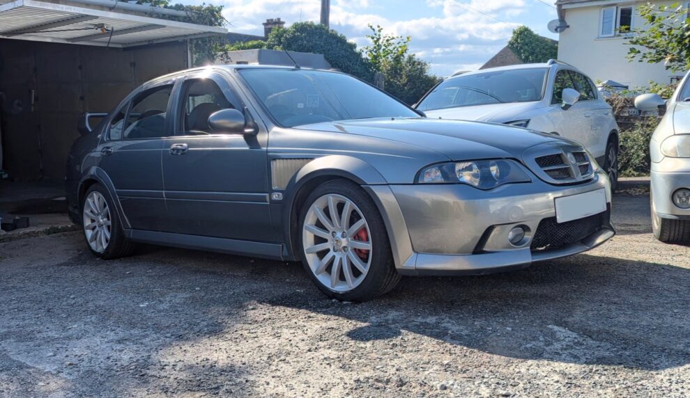 The MG ZS detailed and parked on grass for its first show in July 2024, wearing red brake calipers