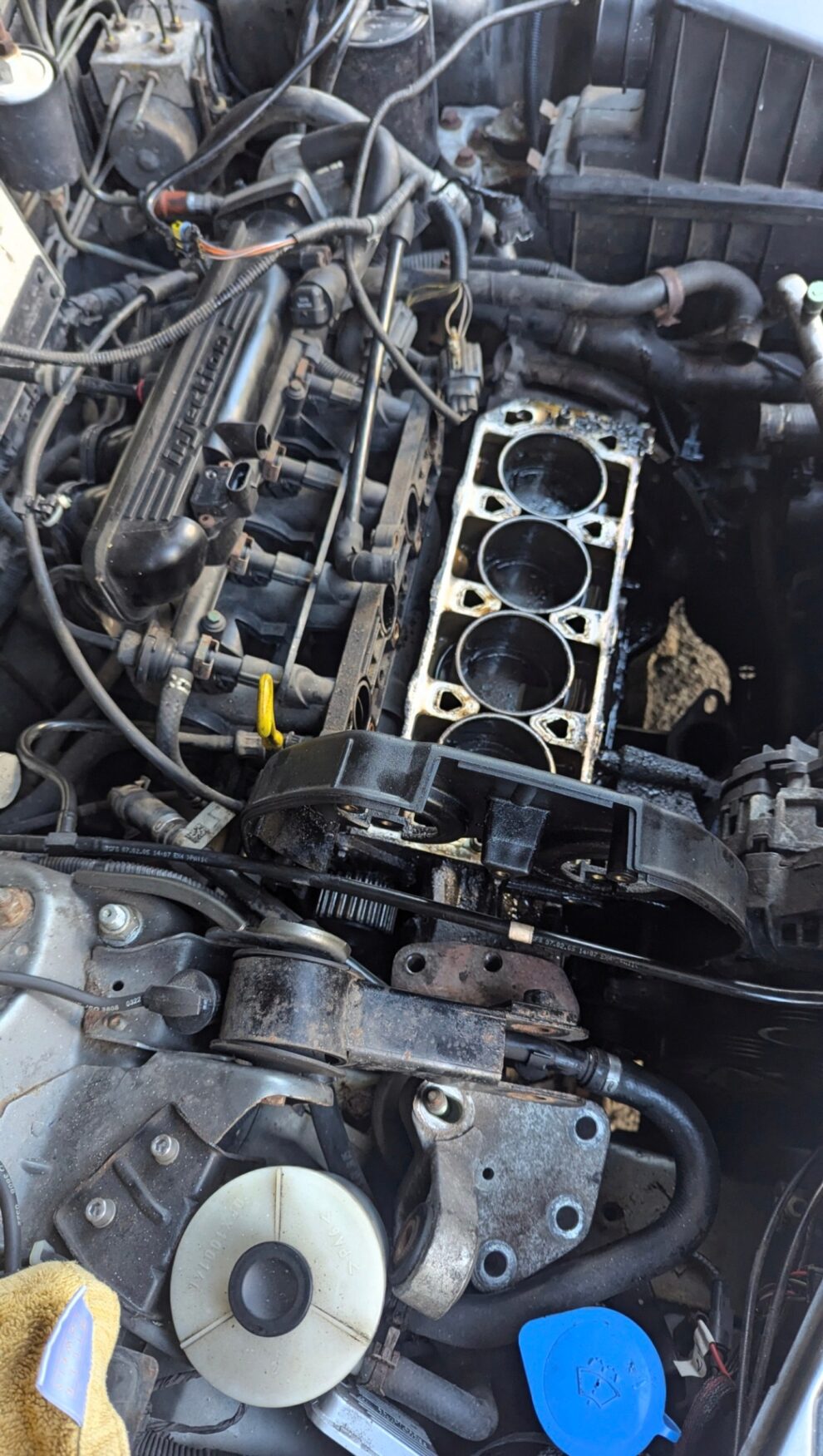 The Rover K Series engine in the MG ZS with the cylinder head removed and the bores exposed