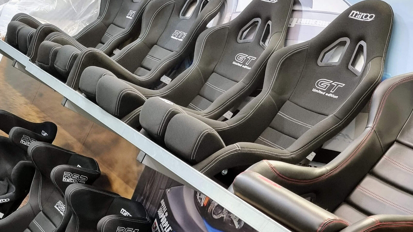 Rows of black Mirco bucket seats on the showroom display shelves