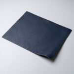 Swatch of navy blue soft grain automotive upholstery leather