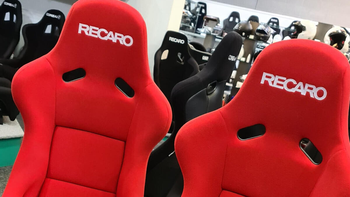A pair of red velour Recaro Pole Position FIA bucket seats in the GSM Performance showroom