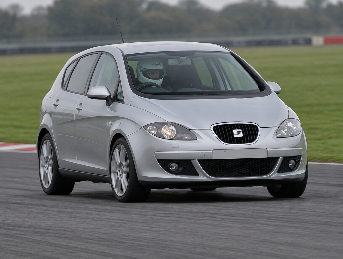 Silver Seat Altea hatchback cornering on a British race circuit with helmeted driver visible