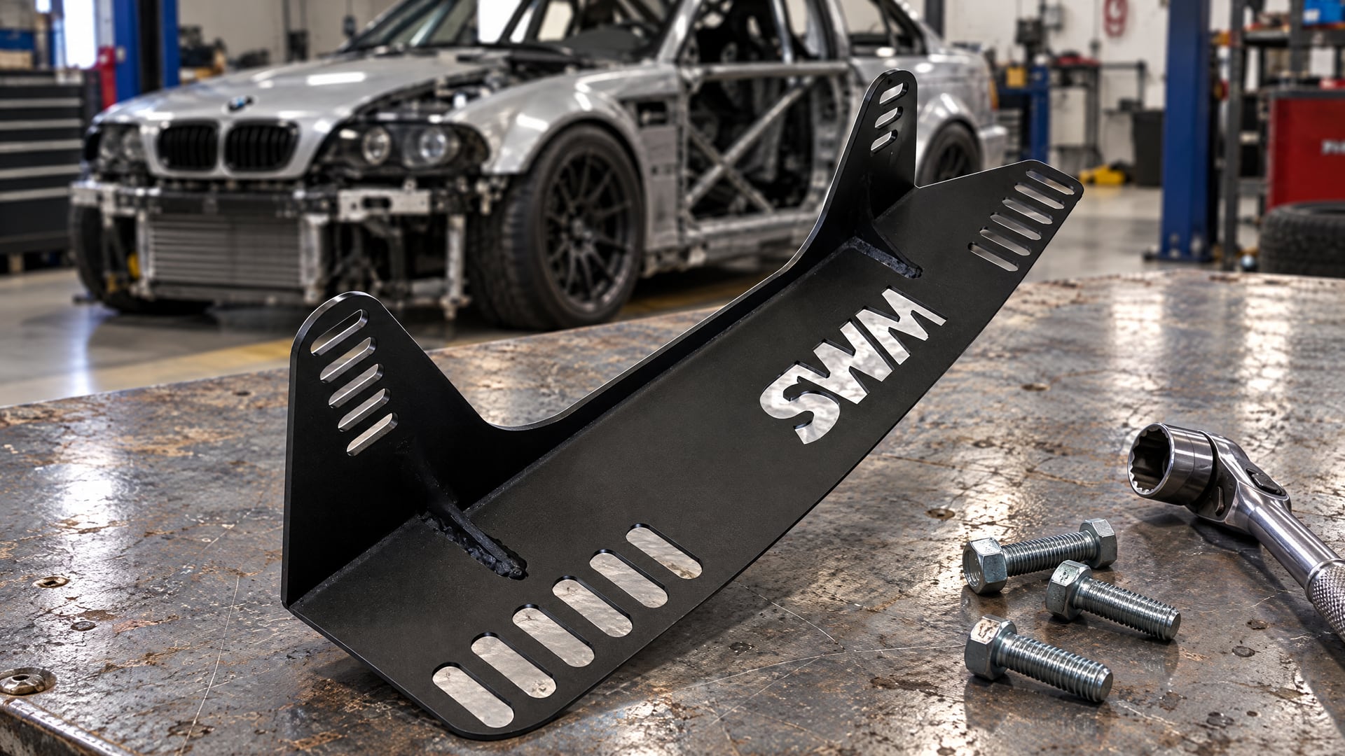 SW Motorsports BMW E46 direct fit seat side mount bracket showing the slotted floor foot
