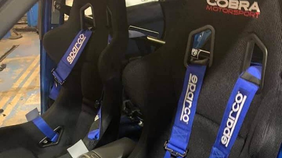 Black Cobra Suzuka T bucket seats with blue Sparco harnesses fitted in a blue Subaru Impreza