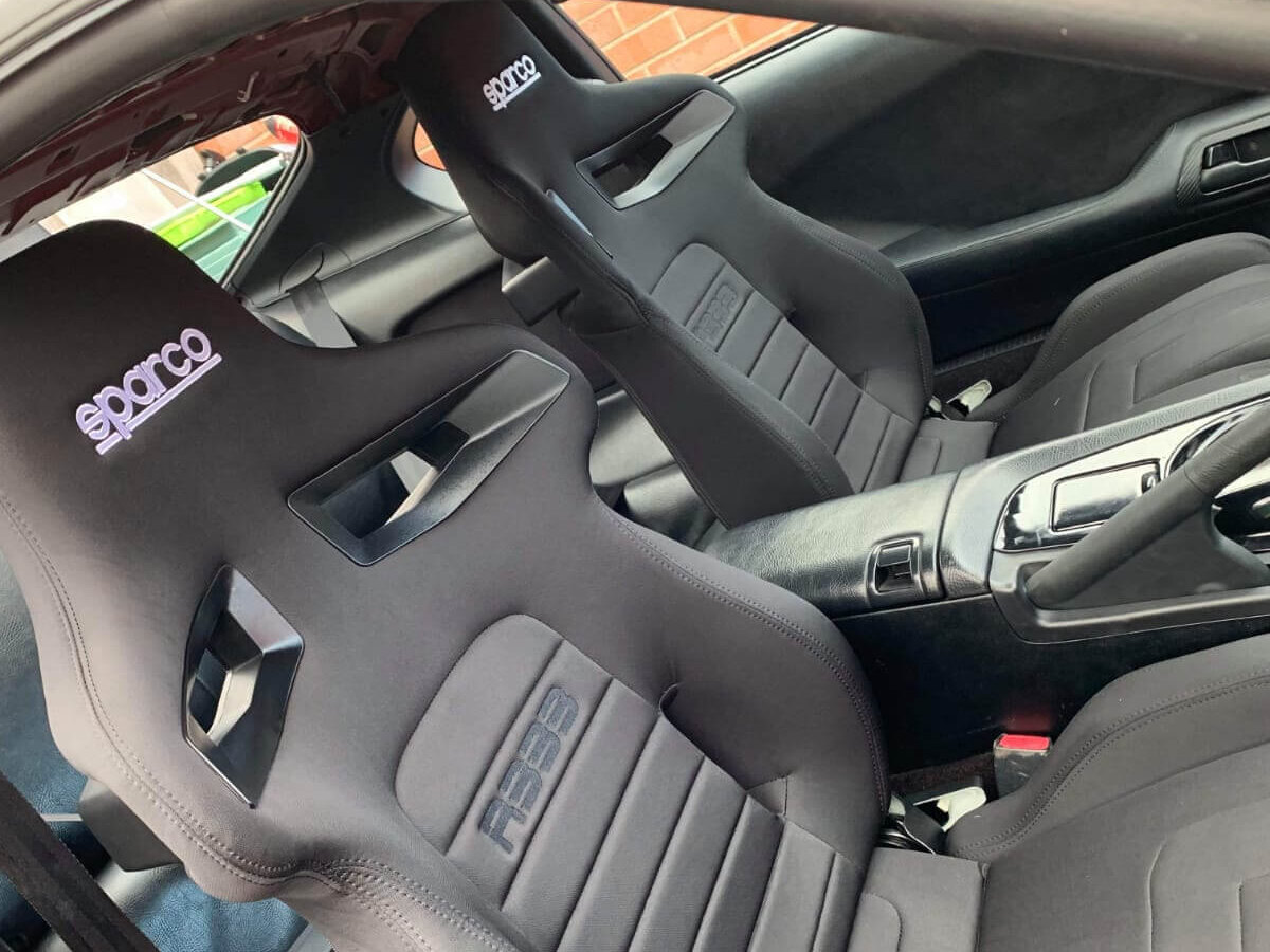 Black Sparco R333 reclining seats fitted in a customer's Toyota Supra Mk4