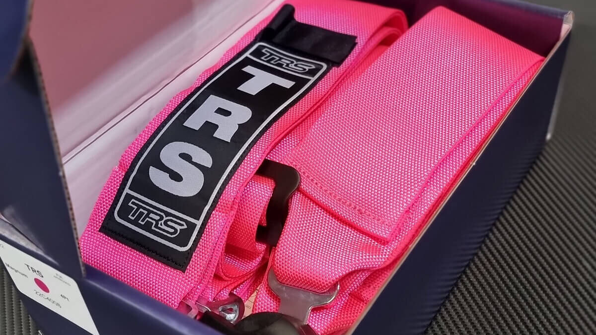 A pink TRS harness in its TRS box