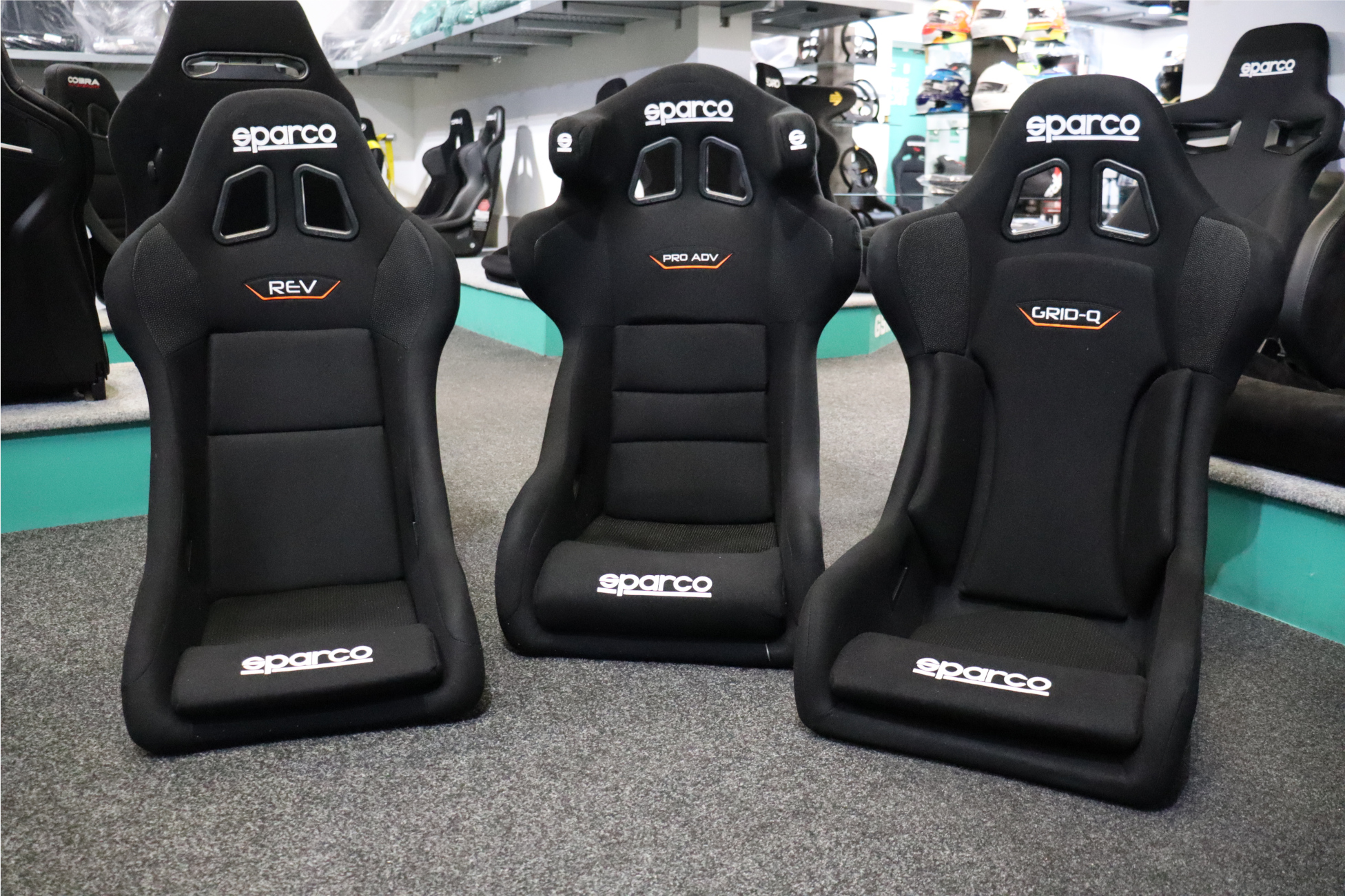 Sparco Rev, Pro ADV and Grid Q sim racing seats on the display floor at GSM Performance